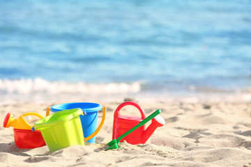 Colorful plastic sand toys on beach