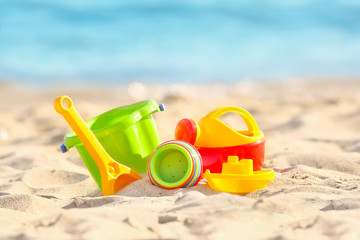 Fototapeta na wymiar Colorful plastic sand toys on beach