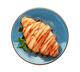 Plate with tasty croissant on white background, top view