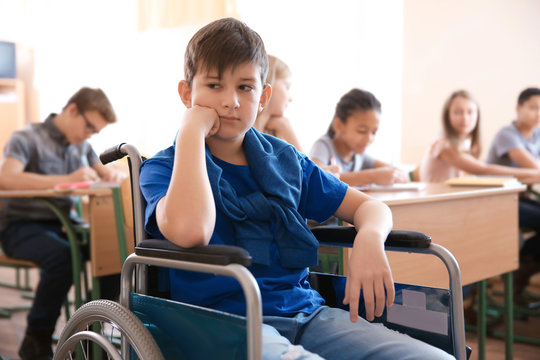 Sad Boy In Wheelchair At School