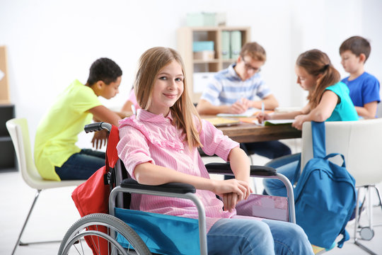 Teenage Girl In Wheelchair At School