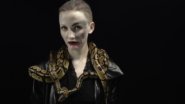 Woman in image with snakes