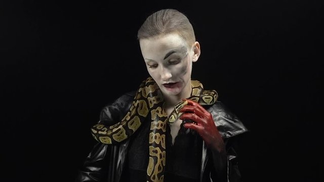 Woman in horror image with snakes