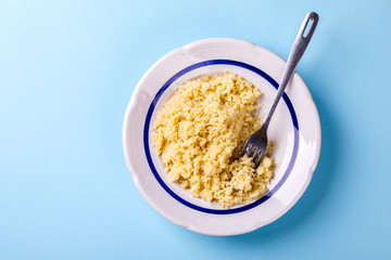 Salad Couscous with Olive Oil on a blue background Top View Copy space for Text  Flat Lay