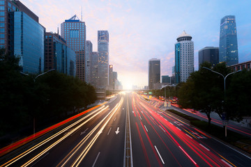 Obraz premium Light trails on the street at Beijing Central Business district at night in Beijing ,China.