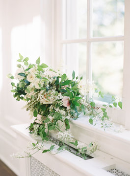 Wedding flower bouquet against window