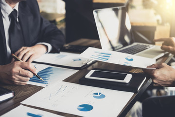 Business people are working in office, presentation in front of boss, businessman leader presentation to colleagues and business strategy and pointing to the graph and chart