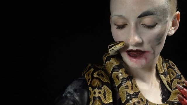 Gentle snake and woman in image
