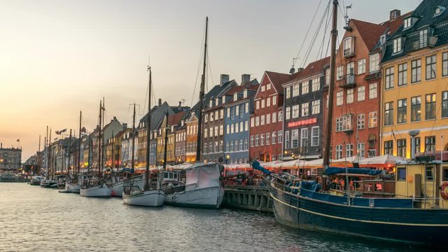 Copenhagen city skyline day to night sunset timelapse at Nyhavn harbour, Copenhagen Denmark 4K Time Lapse