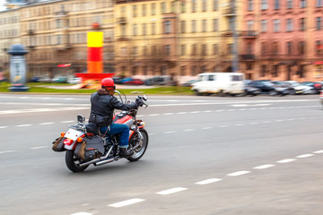 motorcyclist rides at speed on city roads, may 2018, St. Petersburg