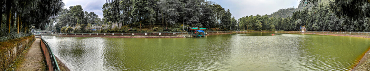 Fototapeta na wymiar Panoramic view of Aritar Lake (Ghati-Tso) or Lampokhari Lake situated in the East Sikkim district of the Indian state of Sikkim under Rongli Sub-Division.