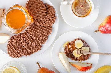 Chocolate waffles with honey and banana.