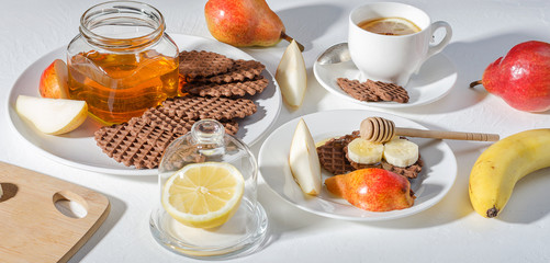 Chocolate waffles with honey and banana.