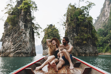 Fototapeta na wymiar Couple boating on a quiet lake