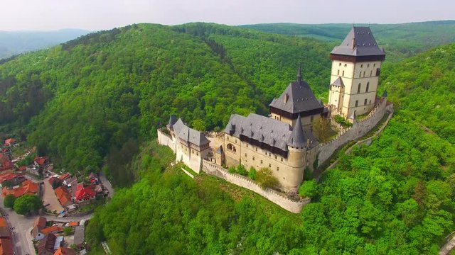 Camera flight around The Karlstejn castle. Royal palace founded King Charles IV. Amazing gothic monument in Czech Republic, Europe. 