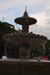 Fountain in the city with summer light