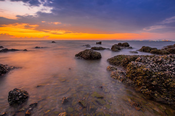 Evening light by the sea. (Laem Chabang Beach), sea change color Always find a photographer to capture beautiful. There are fishermen who come fishing along the coast. Chonburi Province, Thailand