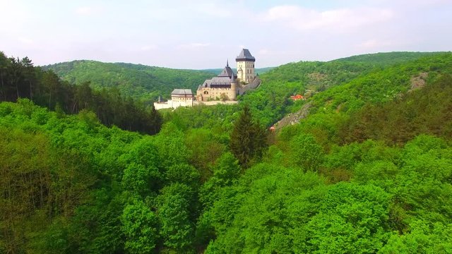 Camera flight around The Karlstejn castle. Royal palace founded King Charles IV. Amazing gothic monument in Czech Republic, Europe. 