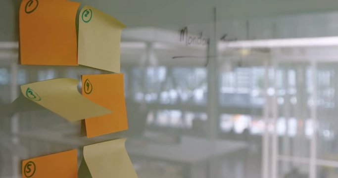 Sticky notes stuck on white board