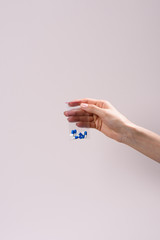 cropped shot of woman holding zip bag with pills isolated on grey
