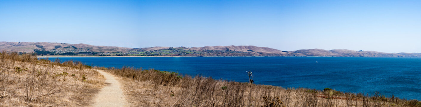 Panorama of trail, ocean and Bodega Bay in the distance from Bodega Head Trail, Bodega Bay, California United States on sunny summer day