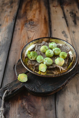 closeup shot of brussel sprouts in plate on cutting board on rustic wooden table