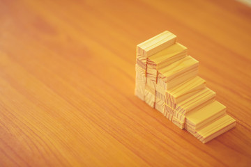 wooden blocks arranging stacking for development as step stair, Concept of growth and success plan.