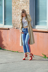 Attractive girl in velvet coat on the street