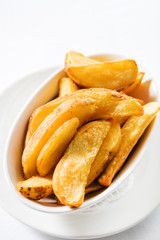 Potato wedges on white