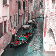 Fototapeta na wymiar View of one of the many canals of Venice, Italy. Venice is a popular tourist destination of Europe.