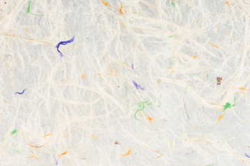 White self made paper sheet texture background. Multicolored embossed yarns, twine, lace pattern.