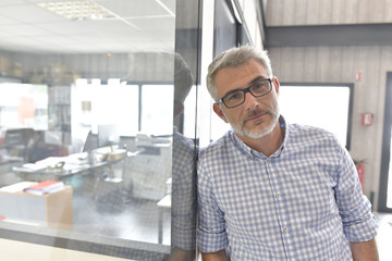 Businessman standing in office building