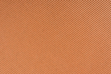 Striped embossed brown paper. Bronze paper texture background