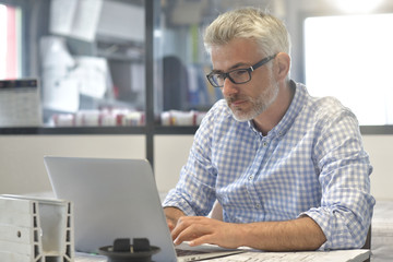Industrial designer working on laptop computer