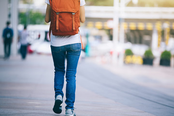 young woman walking in modern city