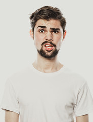 Obraz premium Young bearded man over white background