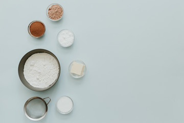 Flat lay ingredients for baking. Minimal baking over pastel background