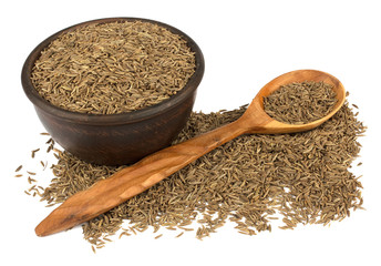 Cumin seeds or caraway isolated on white background. Cumin in spoon.