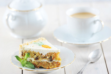 carrot cake slice with mint and coffee