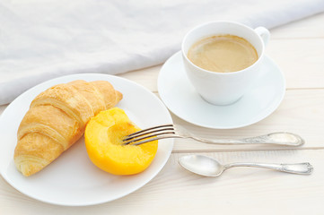 croissant, peach and coffee