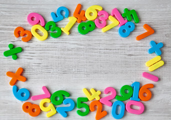 Colorful plastic numbers on a wooden table