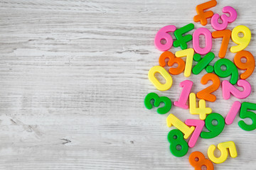 Colorful plastic numbers on a wooden table