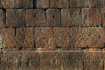 Laterite stone background image in the morning sun.