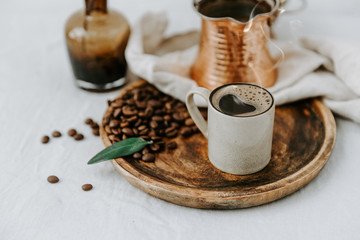 Turkish Coffee Pot and Coffee beens on linen table