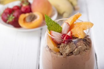 Smoothies with apricot, strawberry, banana and  muesli