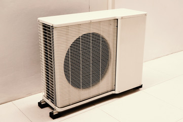 air conditioning condenser on floor of the building