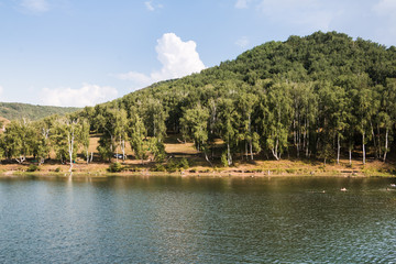 Landscape with clouds, mountain and lake