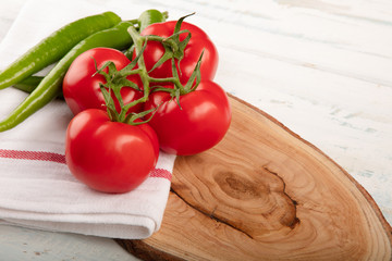 Bunch of fresh tomatoes with green pepper