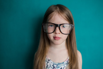 Fototapeta premium serious little girl with big glasses