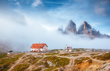 Fototapeta na wymiar Great foggy view of the National park Tre Cime di Lavaredo. Location Dolomiti alps, Italy,